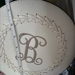 Round zipper crossbody bag with “B” monogram